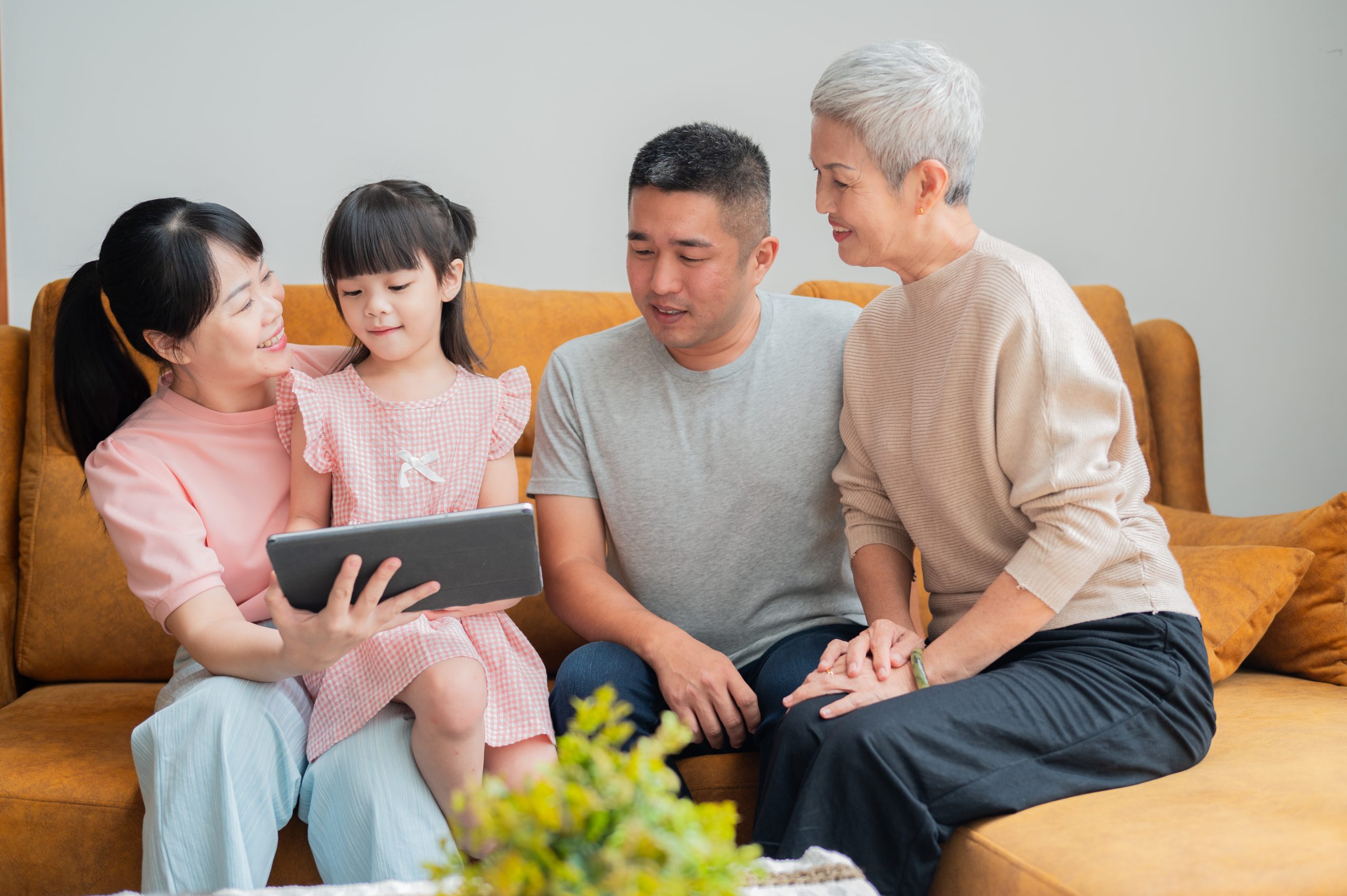 Asian Chinese family spending time together bonding moment at home stock photo